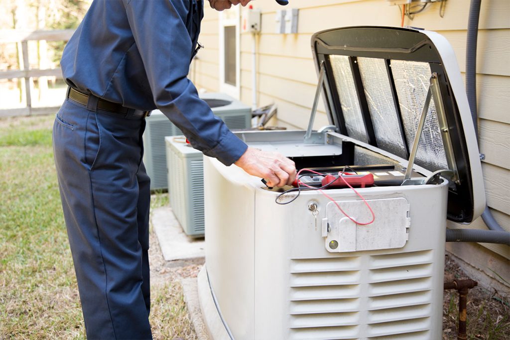Electrician working on generator