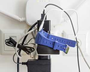 https://www.istockphoto.com/photo/power-leads-and-chargers-with-smart-watch-and-wireless-router-plugged-into-an-gm929702032-254930427